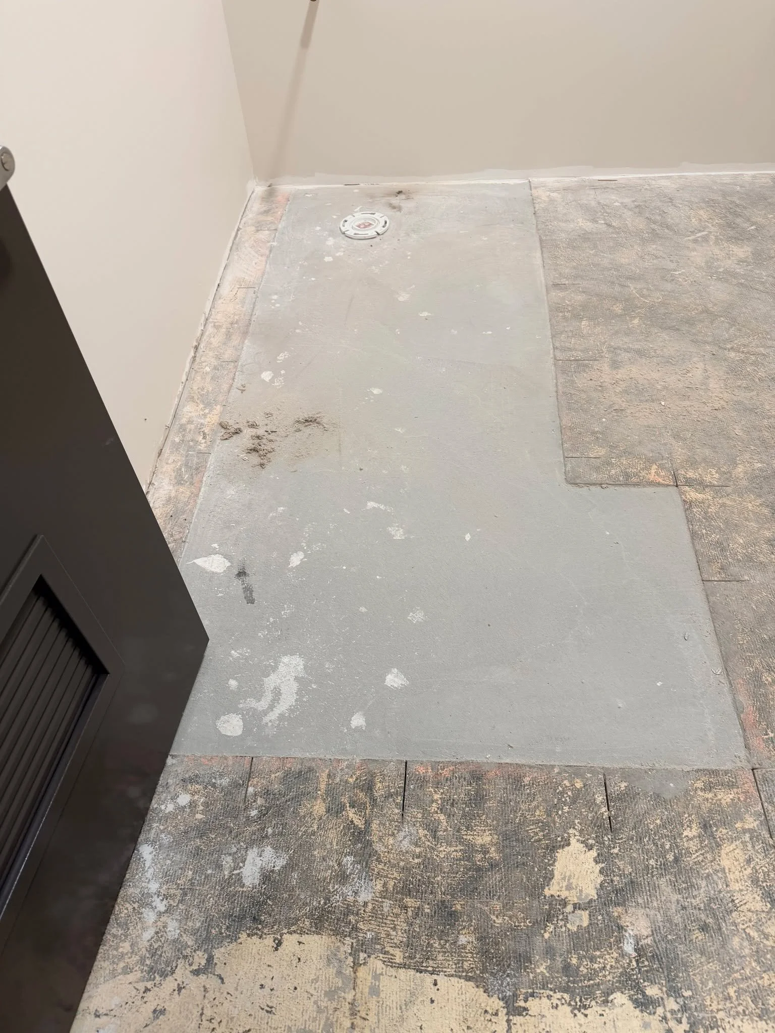 Basement Restroom Refresh &mdash; a true night and day difference.

This project included demo, concrete prep, self-leveling, and a clean LVT install finished off with Schluter transitions and new vinyl cove base. A solid foundation and proper prep m