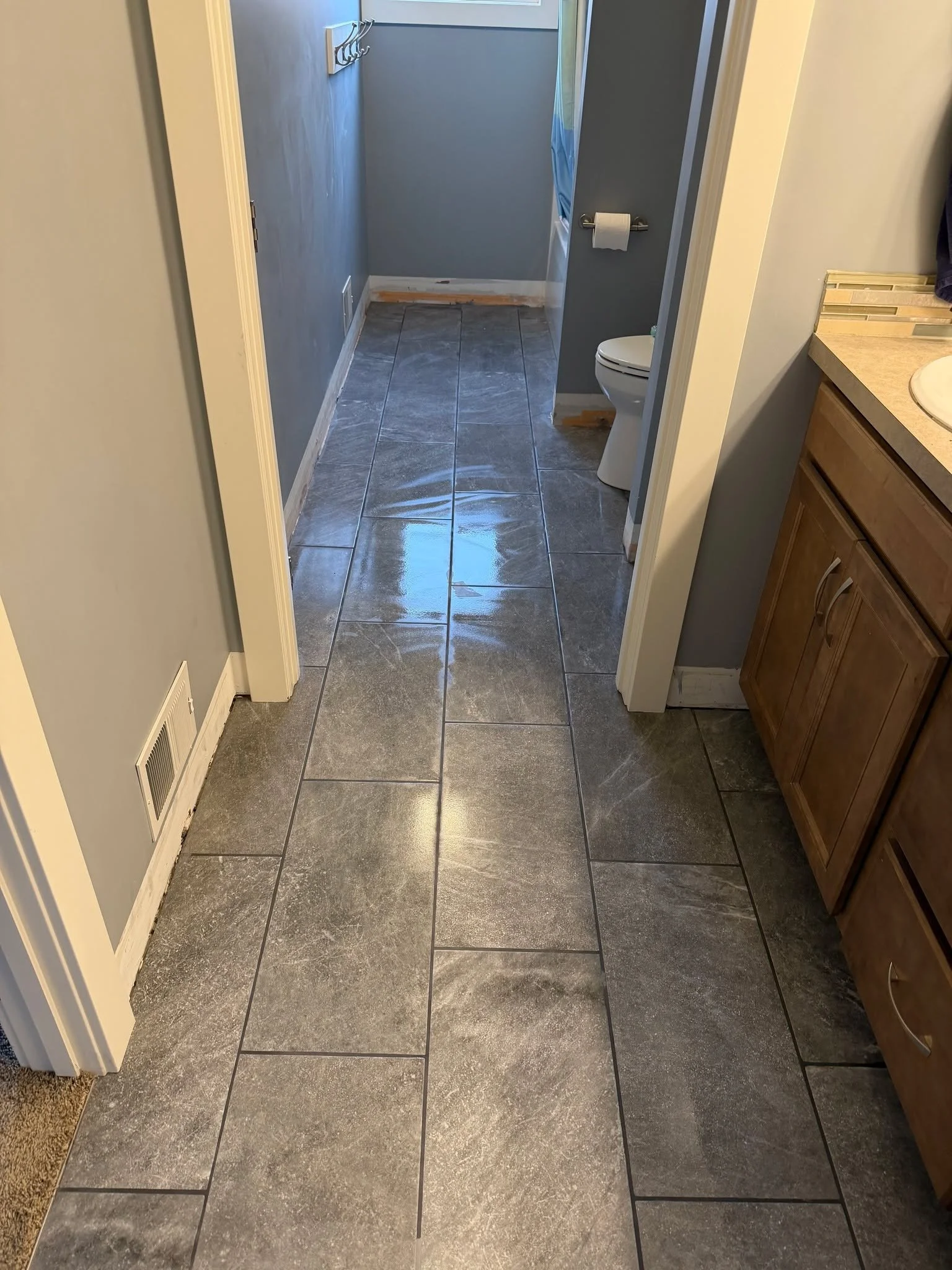 Final result with grout, caulk, and finishing details in place. 
As Crystal says, &ldquo;Donzo with the funzo.&rdquo;

#PreferredFlooring #SettingTheStandard #OneInstallationAtATime