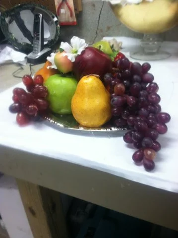 FORMAL  BANQUET TABLE SETTING, FAKE FOOD: A Little Night Music:              carpet, rope, styrofoam, fomecore,foam rubber, fake fruit, rope, mixed media