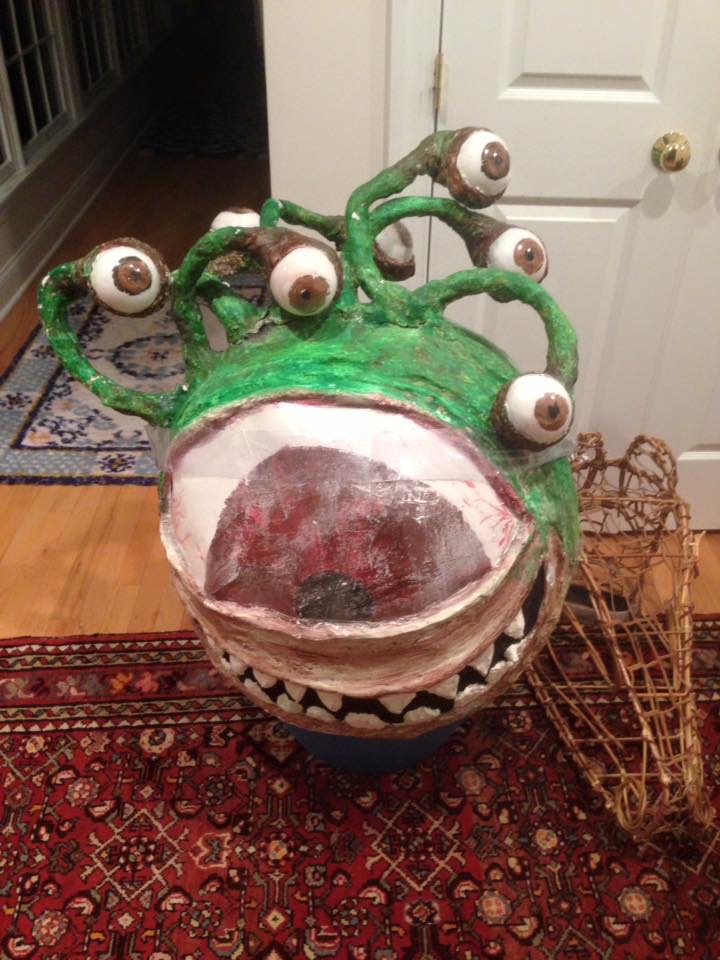 BEHOLDER:  She Kills Monsters--giant beach ball,  papier mache, clear Christmas ornaments, plastic
