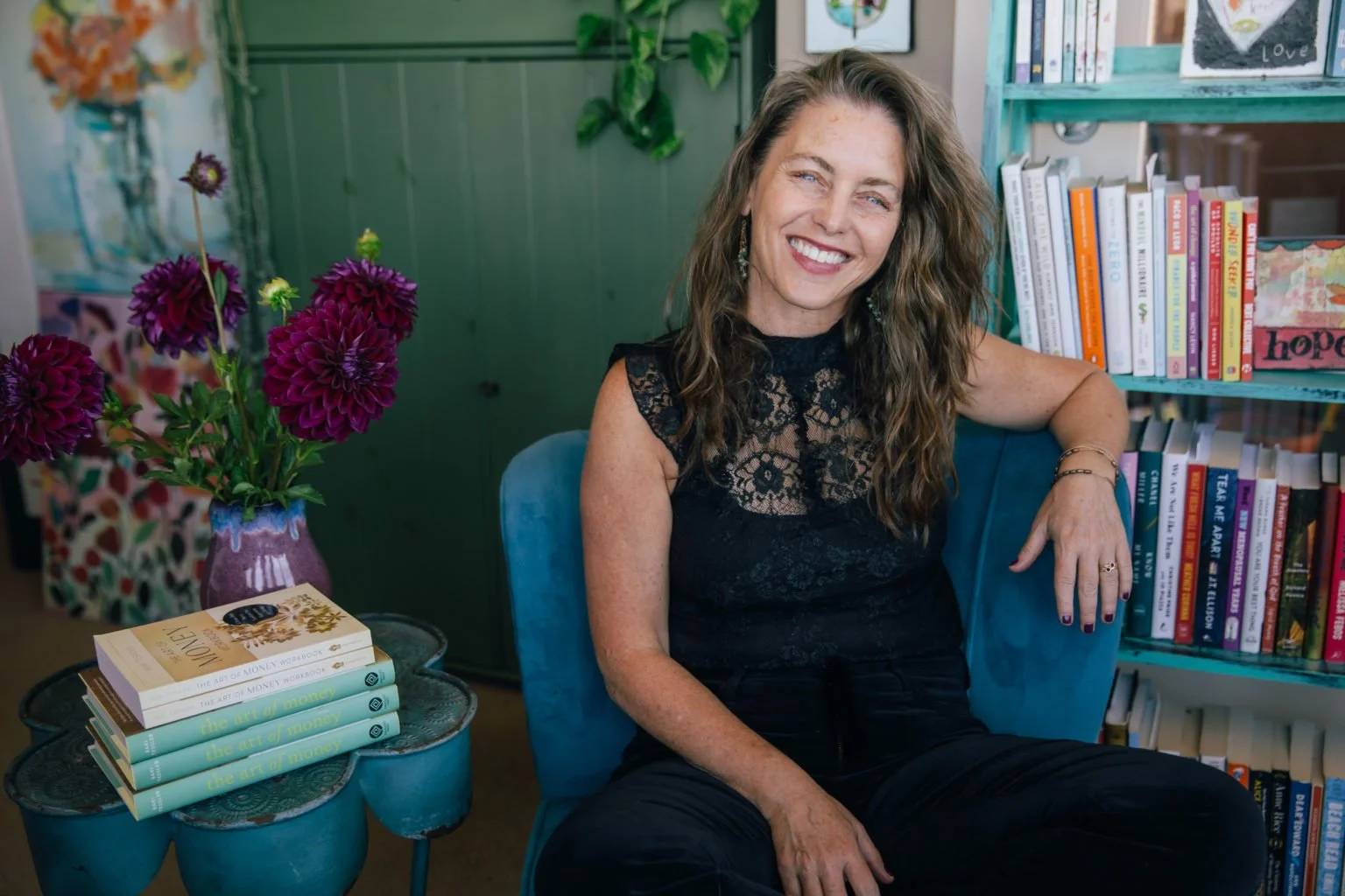 Bari Tessler, financial therapist, smiling in her office