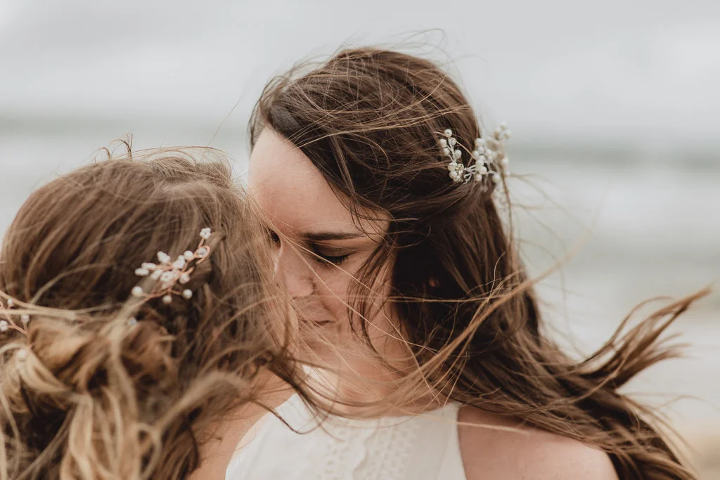 Cliffs of Moher wedding. Two brides kissing.