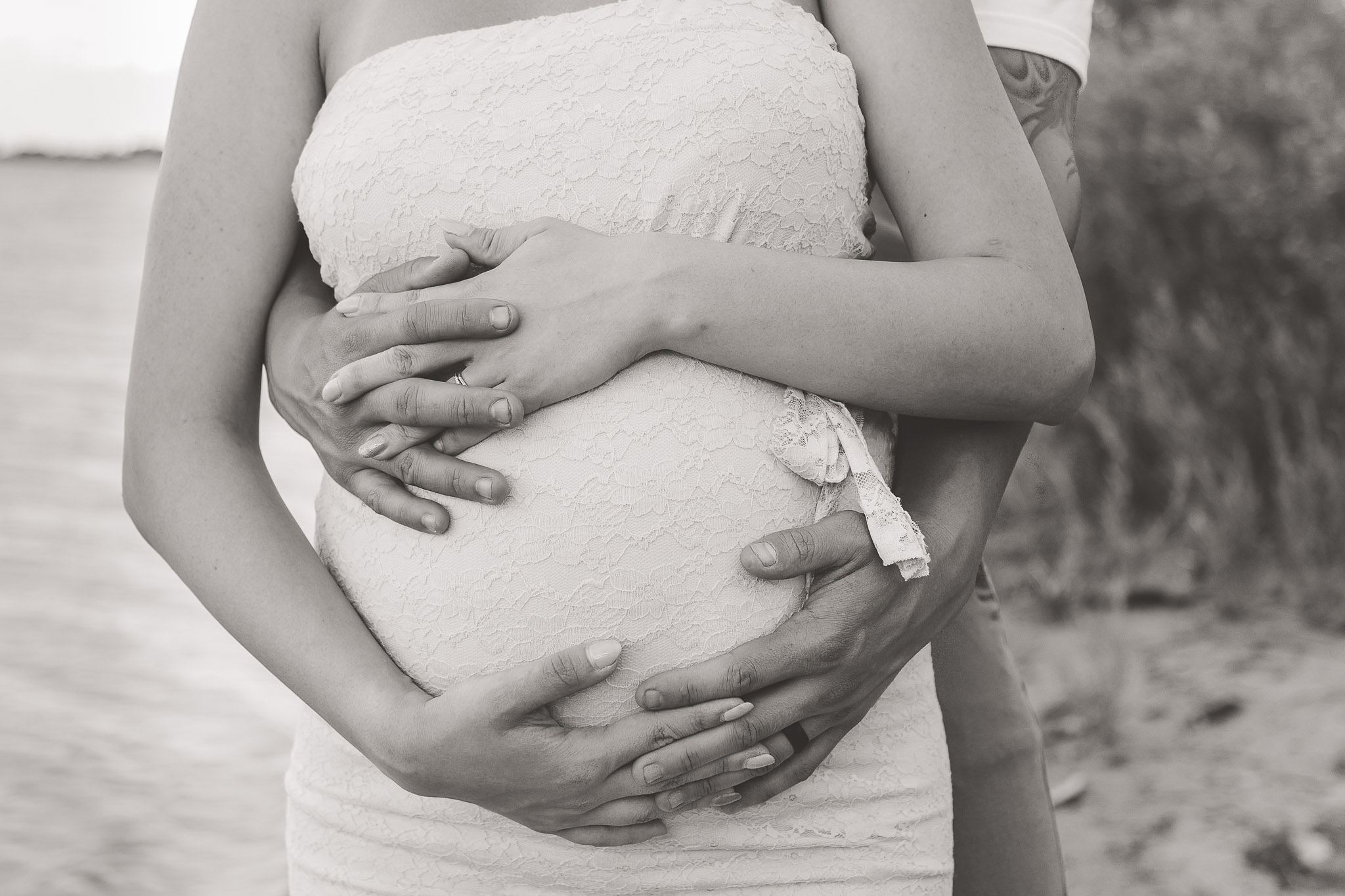 Maternity-Holding-Hands-Around-Belly-Close-up.jpg