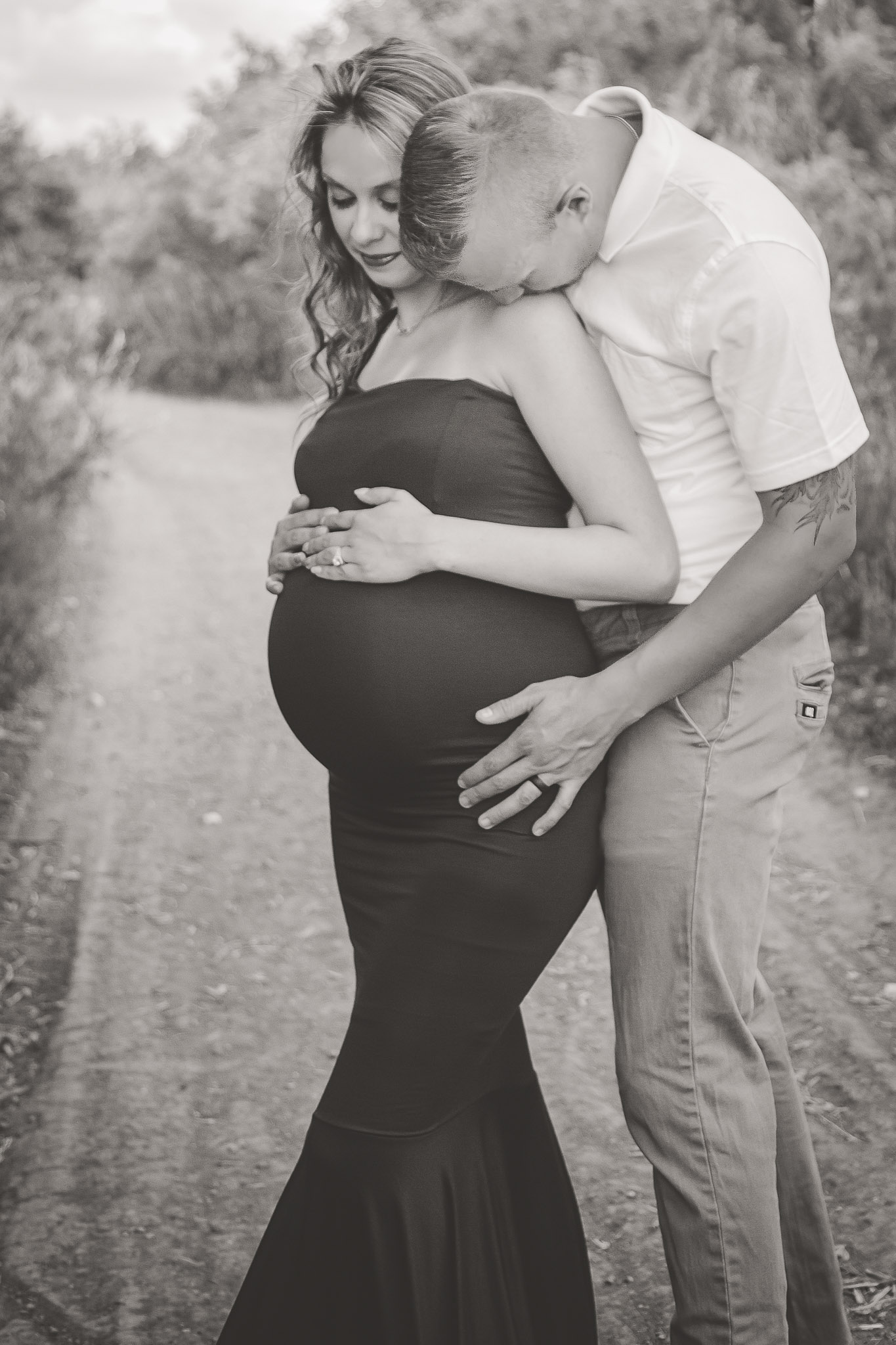 Romantic-Maternity-Couple-Kissing-Shoulder.jpg
