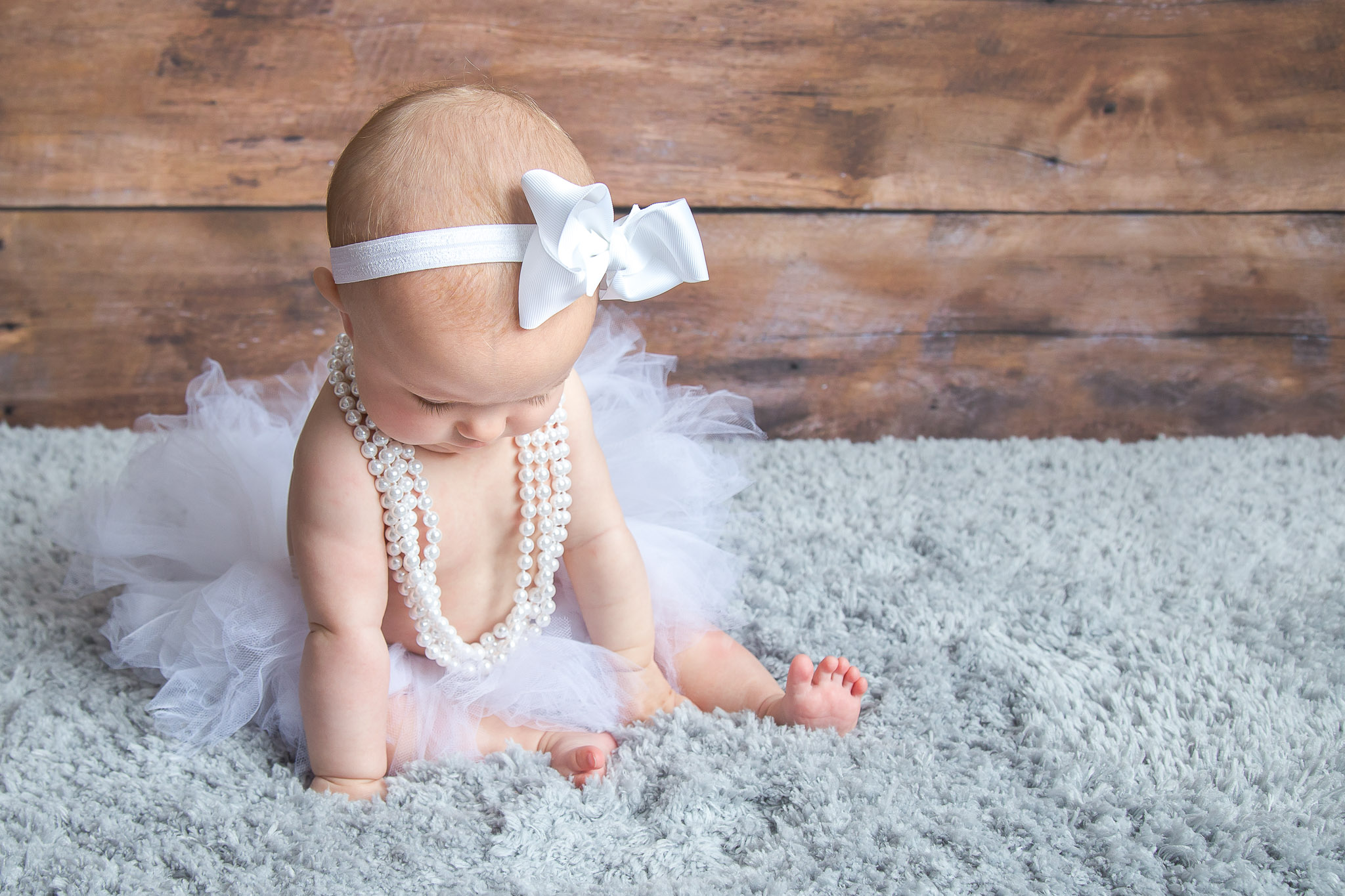 baby-girl-white-tutu-pearls-bow.jpg