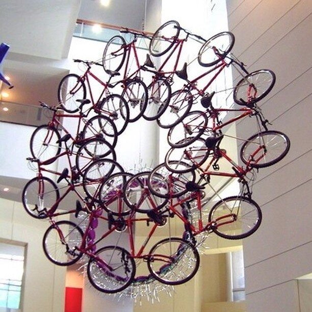 It's Bike to Work Day here in Denver! In celebration we are looking back at a project we worked on with artist Donald Lipski back in 2003 entitled 'Five Easy Pieces'. This series of suspended sculptures are made from actual: guitars, tennis racquets,