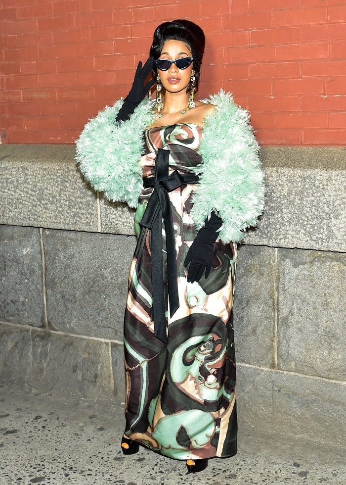 Cardi B showed out at the Marc Jacobs fashion show during NYFW, wearing a printed dress paired with a furry sea-foam green shawl.