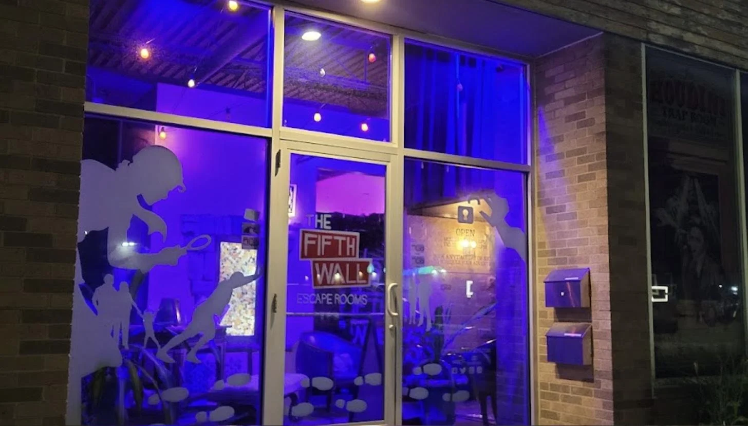 The Fifth Wall Escape Rooms storefront at night in Ferndale, Michigan