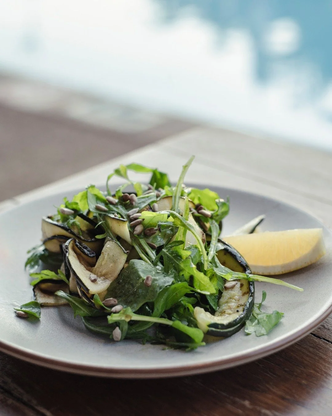 Our Grilled Courgette with toasted pine nuts, a squeeze of lemon, olive oil, herbs &amp; rocket. Proof that greens can absolutely steal the show. 

Simple, fresh, and full of flavour!

Whalers Restaurant Exmouth | Open 7 Days | Breakfast, Lunch &amp;