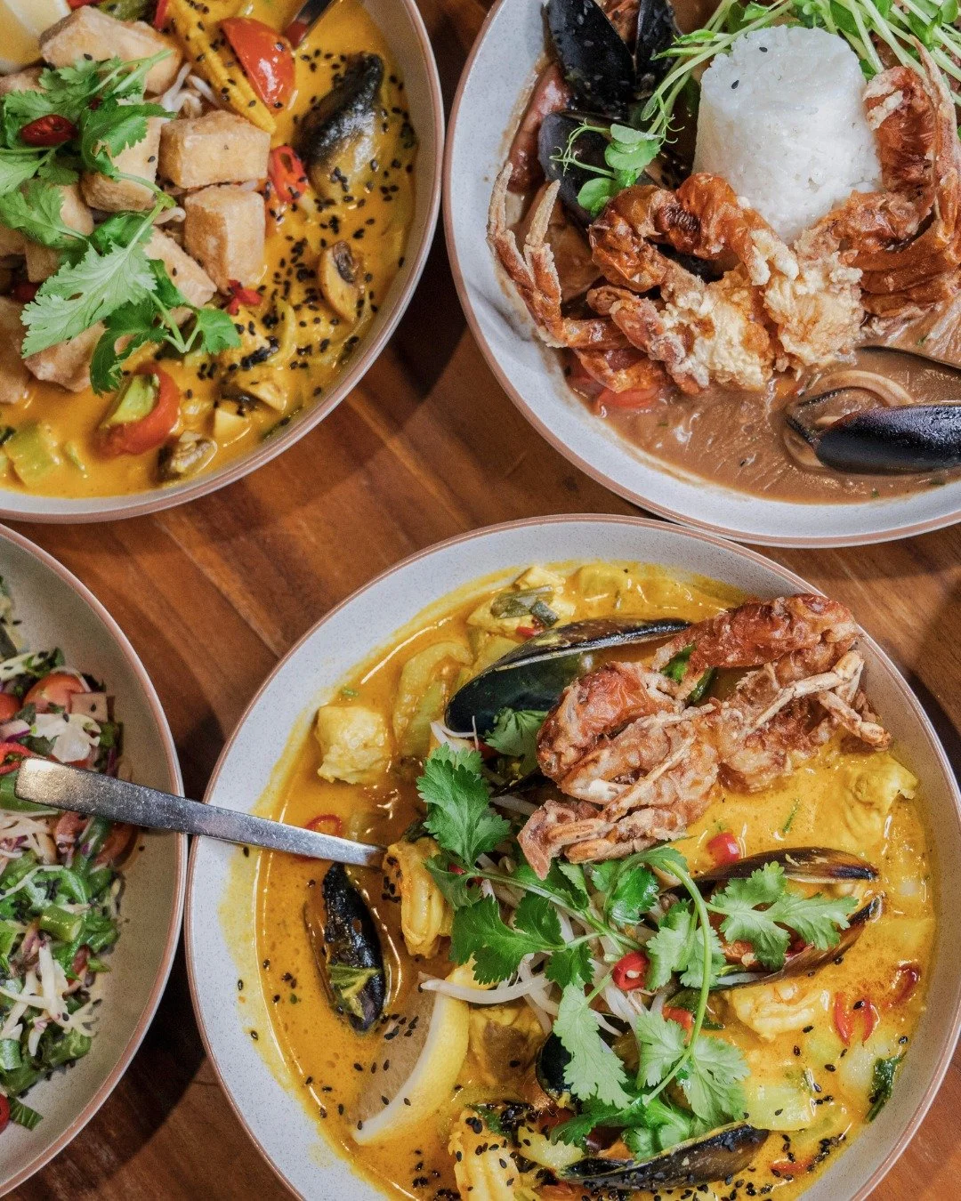 Pictured here: our rich Seafood Laksa, creamy Vegan Laksa, and soulful Seafood Gumbo&hellip; plus just a peek of our Crunchy Asian Slaw with peanut satay and crispy tofu. 🌶️🍤🥥

Bowls of comfort, bursting with flavour!