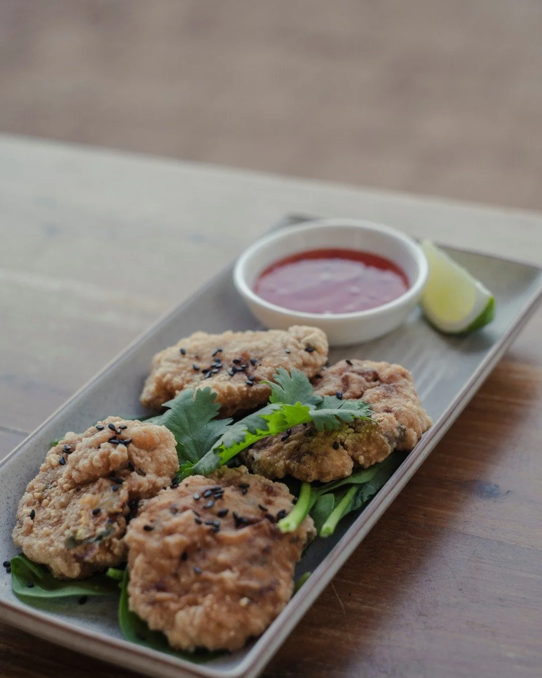 Bang Bang Chicken Wings

Crispy, saucy, a little bit spicy&hellip; basically everything wings should be. 

Four golden wings with black sesame + Sriracha mayo.

Perfect for sharing, though you probably won&rsquo;t want to!