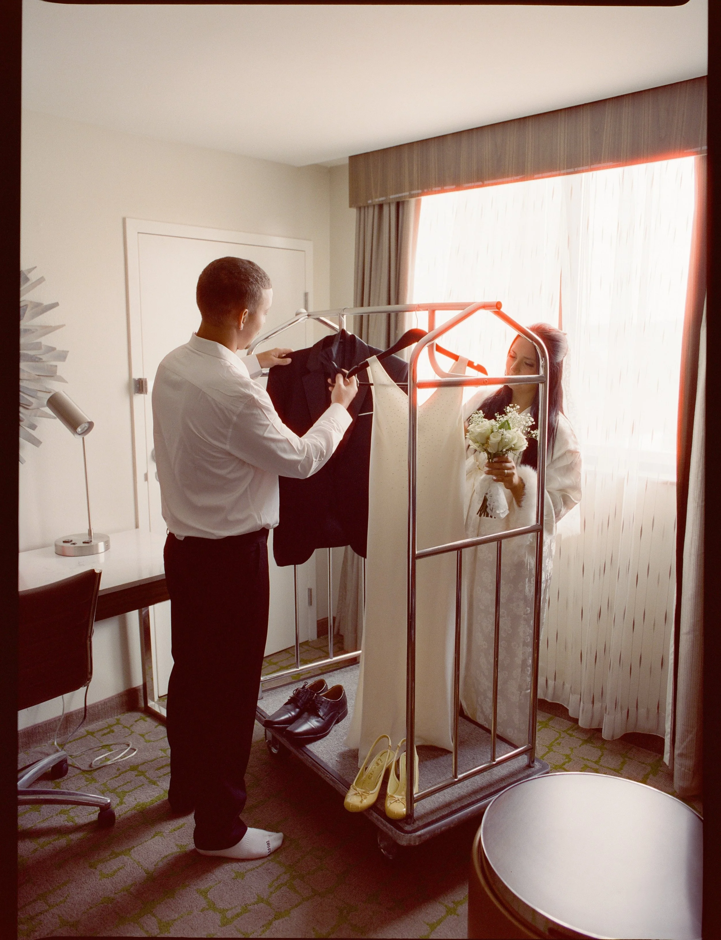 An intimate courthouse wedding &mdash; getting ready together at the hotel room. 💛

&bull; mix of medium format 120 film &amp; 35mm film

dakotaburnsphotography.com

📍Huntington, WV