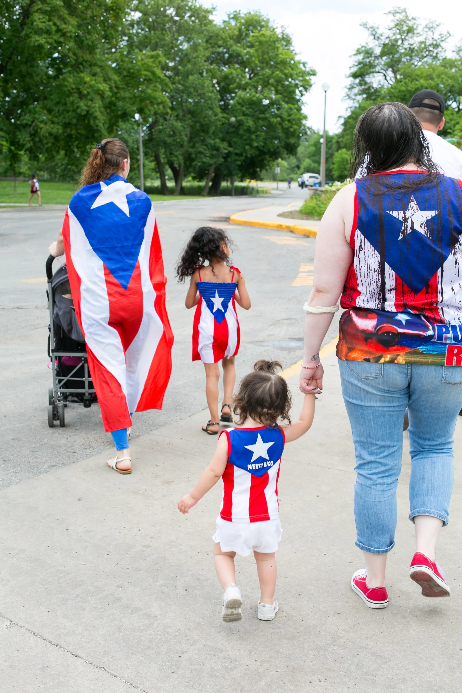 A family walking to the Puerto Rican Festival in Humboldt Park, a heavily Puerto Rican neighborhood in Chicago. 