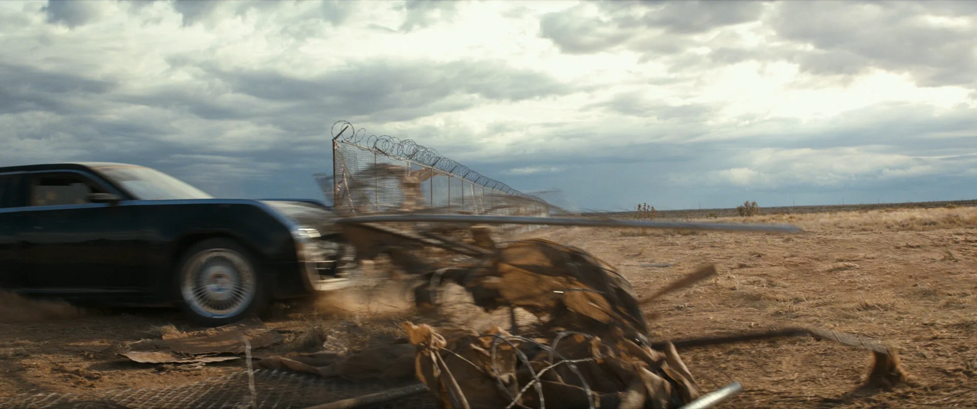 The limo on this shot is real. For this shot I had to do cleanup to remove rigs that were using on location. I also removed some wires that were on the real fence.