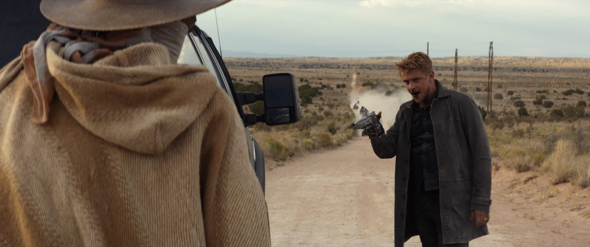 Another CG hand and CG gun. I also had to rebuild some of the moving background like the cars and dust so that I could remove the real hand of the actor.
