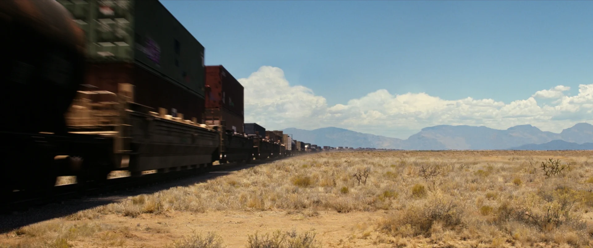 The camera pans to reveal the long train. Besides adding the train I had to stitch a couple of matte paintings and apply the camera move.