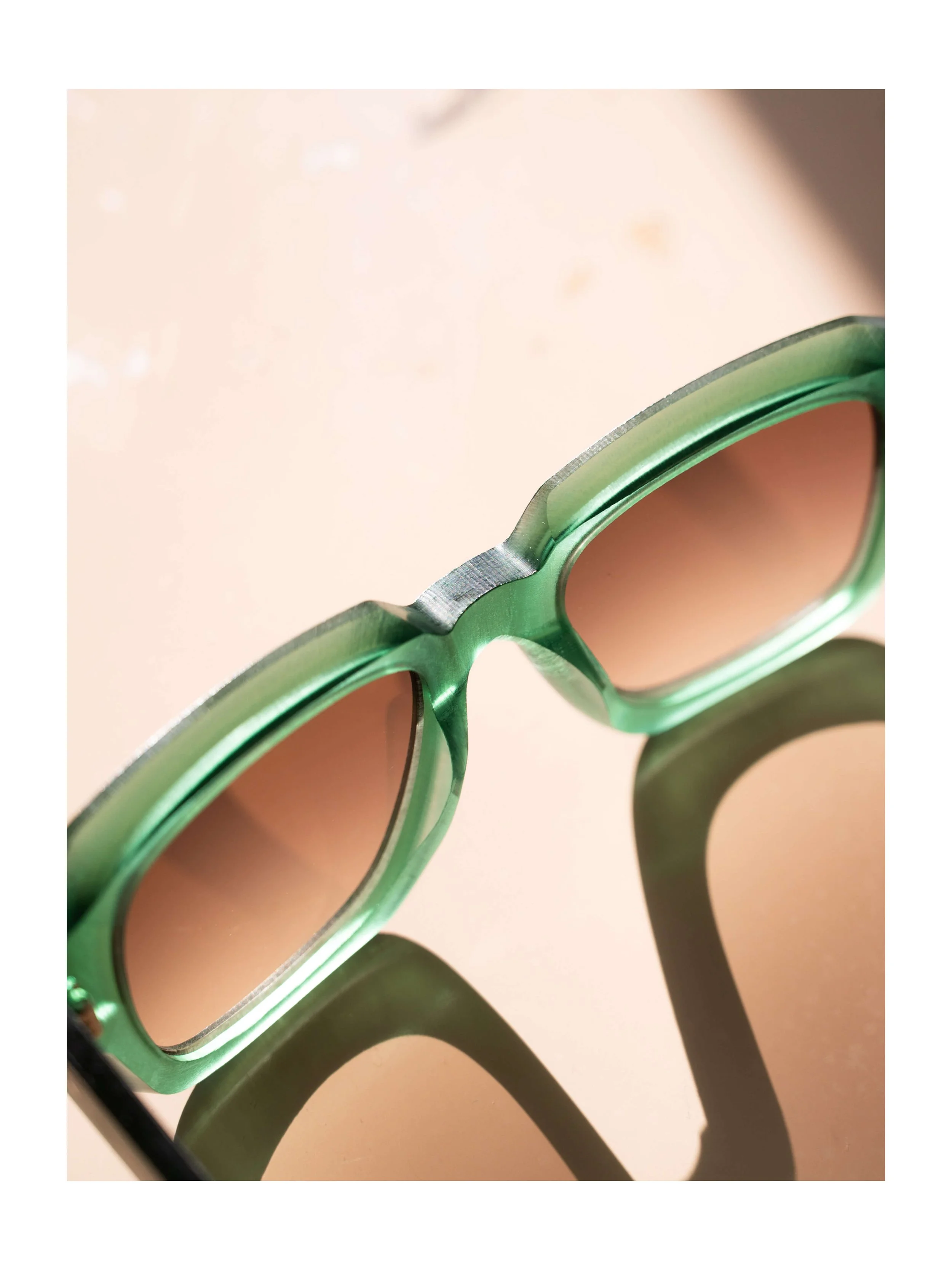 Dandy's Green acetate sunglasses with natural shadow light — commercial eyewear photography by Daniel Ponce, San Francisco