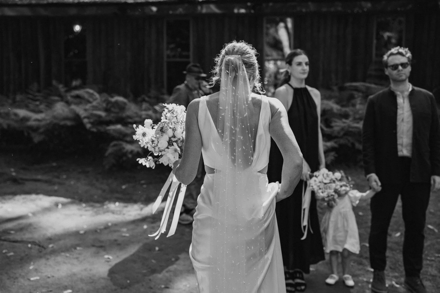 One of those fleeting, candid moments that make a wedding day feel so real. 
Jess walking to their family photos. The gorgeous bouquet by @piaandjade was the perfect touch for such a relaxed, heartfelt celebration along with Jess' dress by @preajames