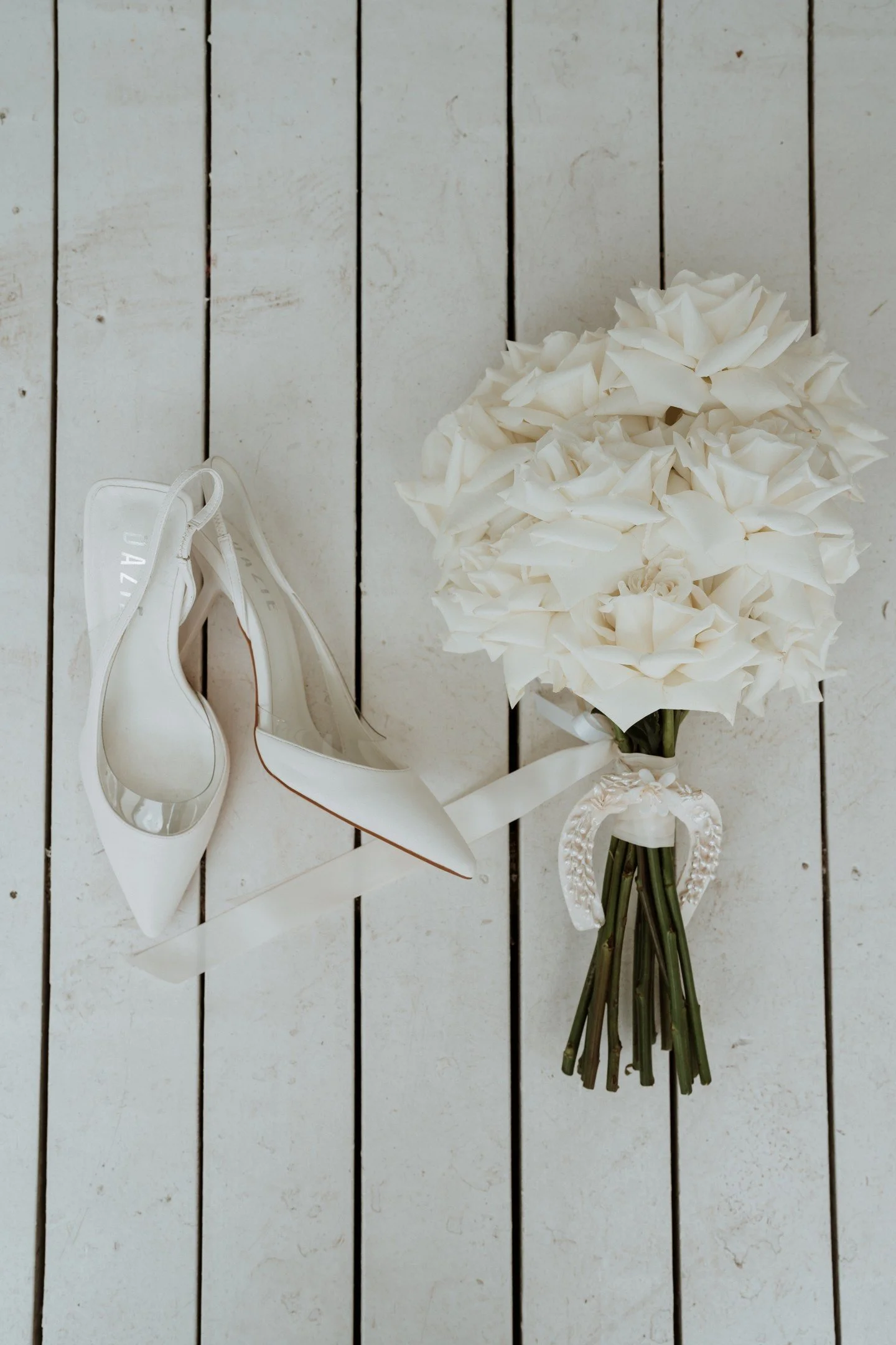 Getting ready at The Cove in Jervis Bay always has this calm, coastal feel. Zoe&rsquo;s wedding morning started with the perfect details, soft white roses and chic heels, the kind of simple elegance that set the tone for their special day on the Sout