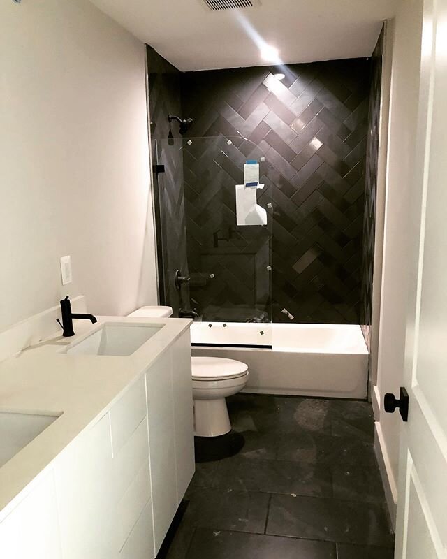 Bathroom Goals! Black and White never looked so good!!! We used a combo of black matte and glossy subway tile in herringbone. This is so lit I think I may put it in my basement bathroom! @thinkspeakcreate @creativereflectionsdesign