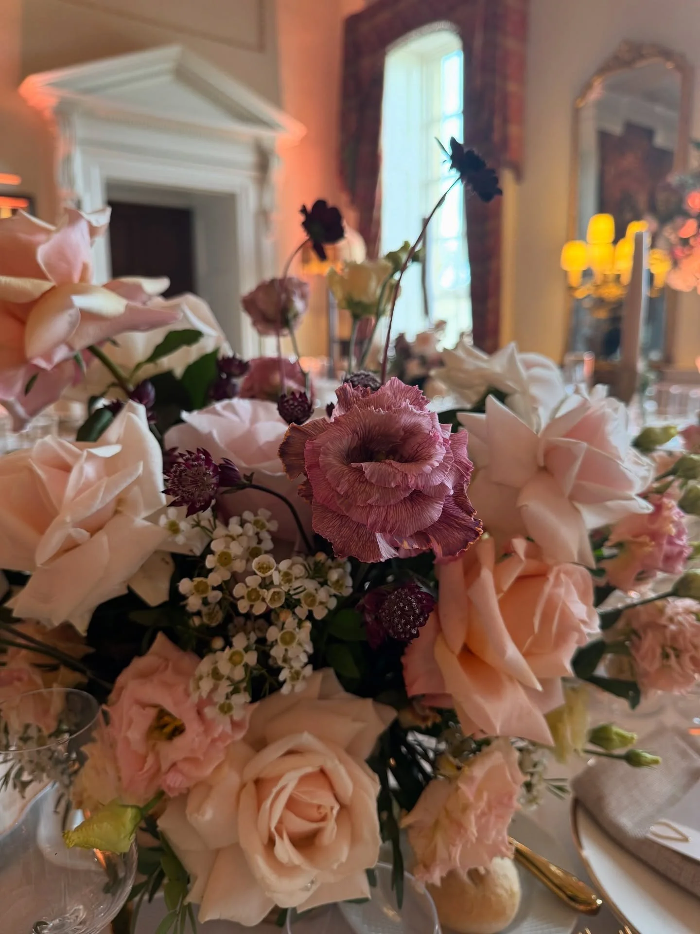 MAGIC happens when client believe in our creative flare. 
Blush, peachand cream roses, Pale pink lisianthus, adding a delicate, ruffled texture.Tiny white waxflowers, bringing a touch of texture and contrast among the larger blooms.
Dark burgundy sc