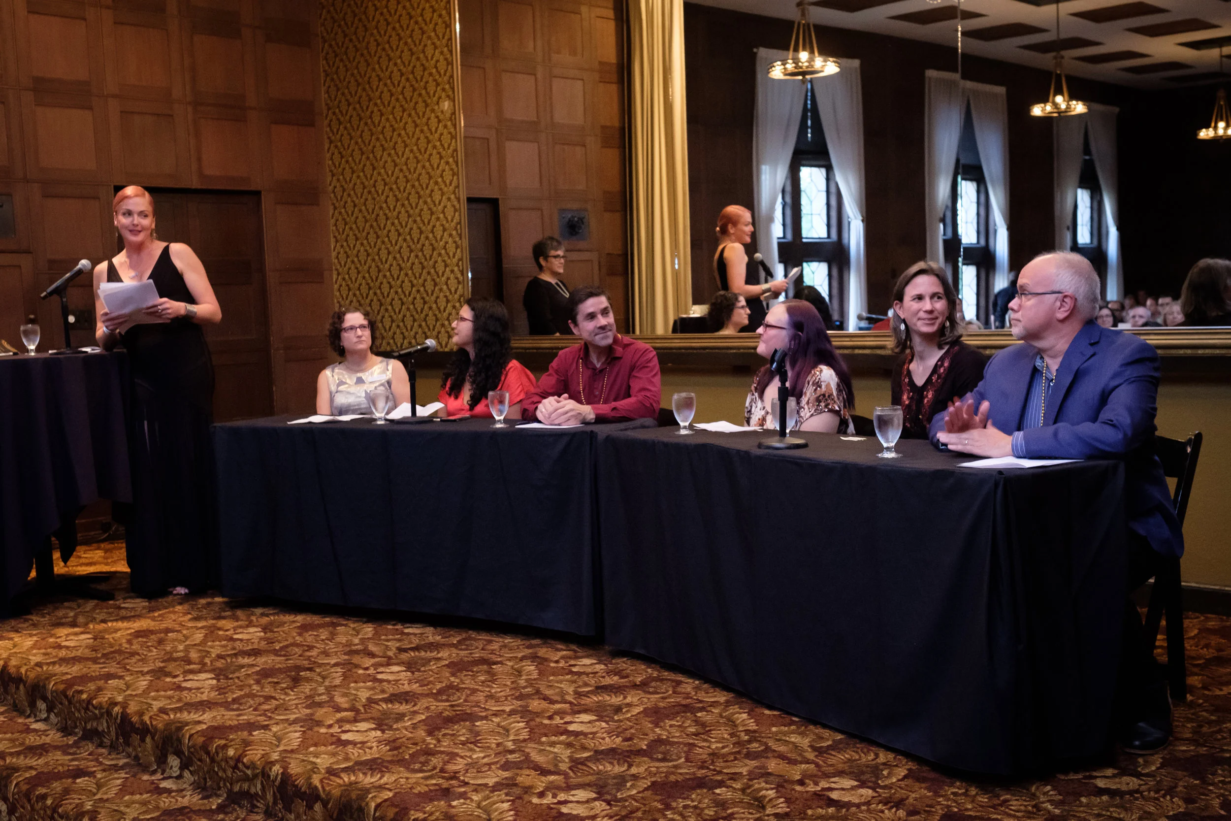 Living Yoga 2018 Panel Discussion (from left to right): Storm Large (Emcee), Liz Eisman, Sarina Saturn, PhD., Glenn Montgomery, Michelle Barton, Dr. Dawn Mautner, and Harry Dudley, Psy.D.