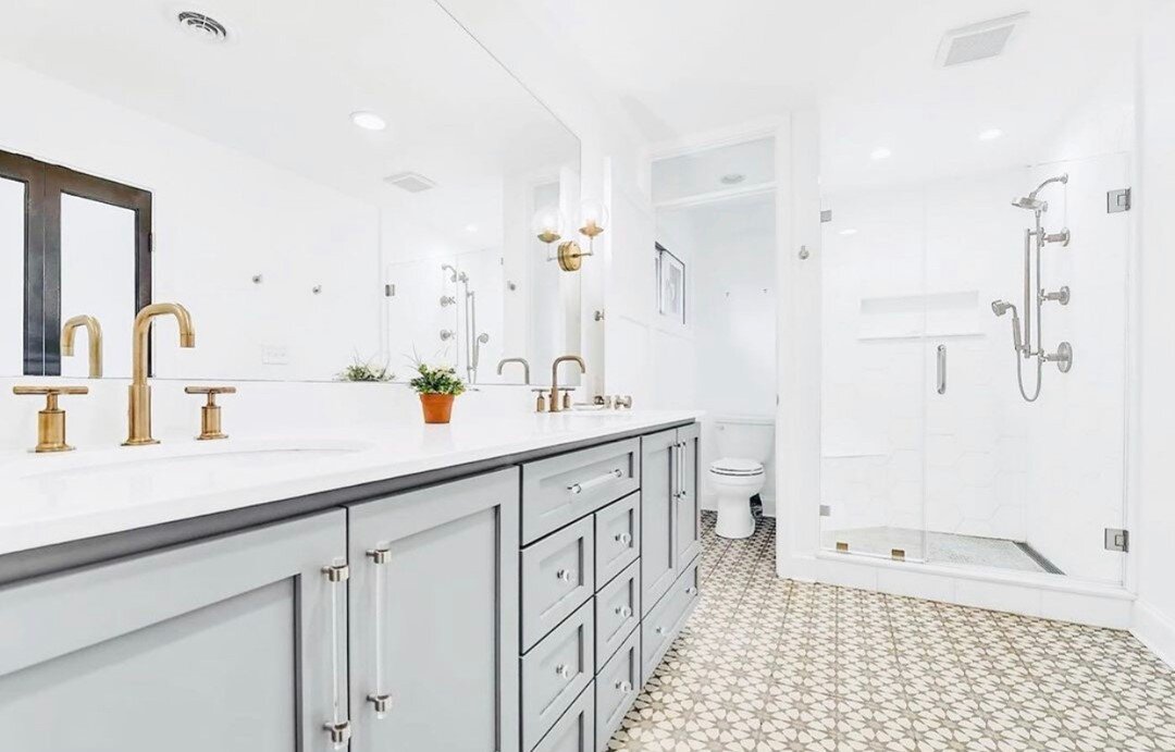 This tile from @cementtileshop is probably my favorite element of this remodel- and there's so much to love! It plays so well off of the gold faucets and lighting as well as the gray in the vanity.