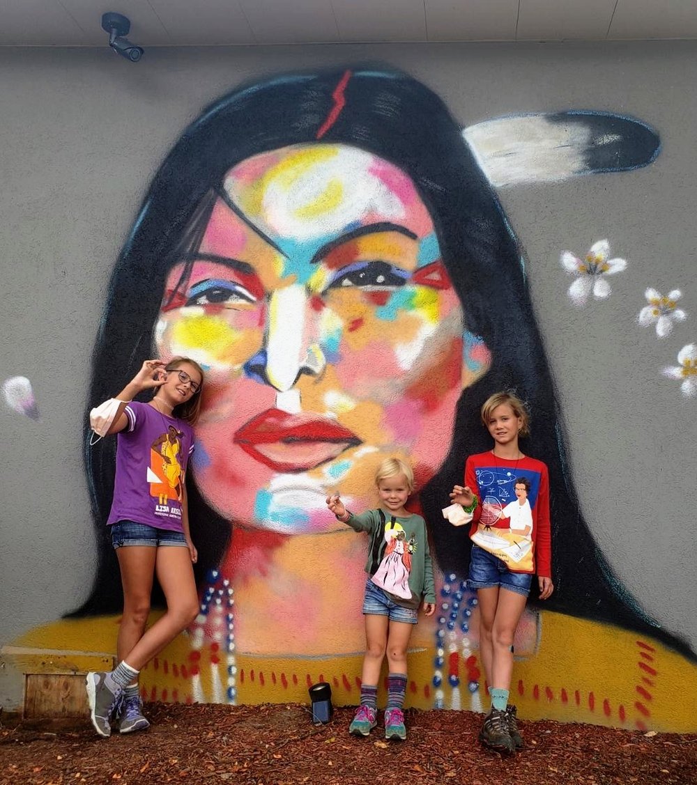 Children Posing in Front of J. Nicole Hatfield's Indigenous Goddess Mural