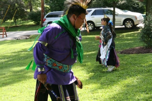 Member of the Osage Nation Performing a Traditional Dance in Front of MONAH