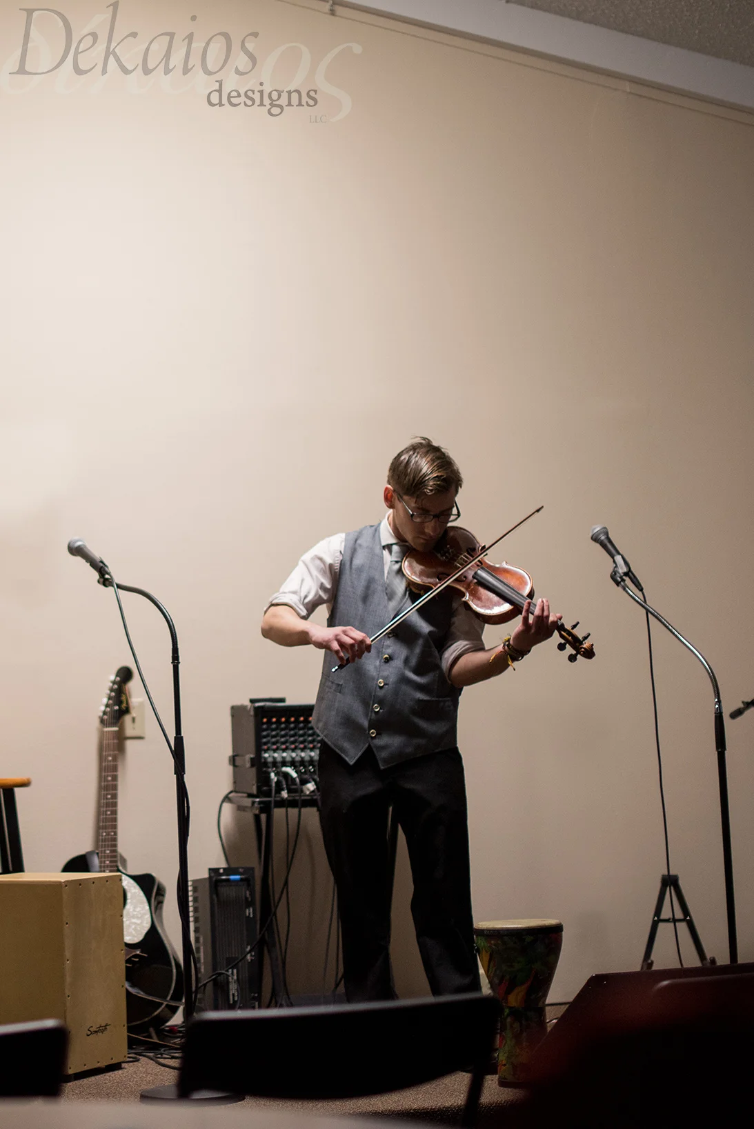 My son at his violin recital ( I apologize it was so dark)