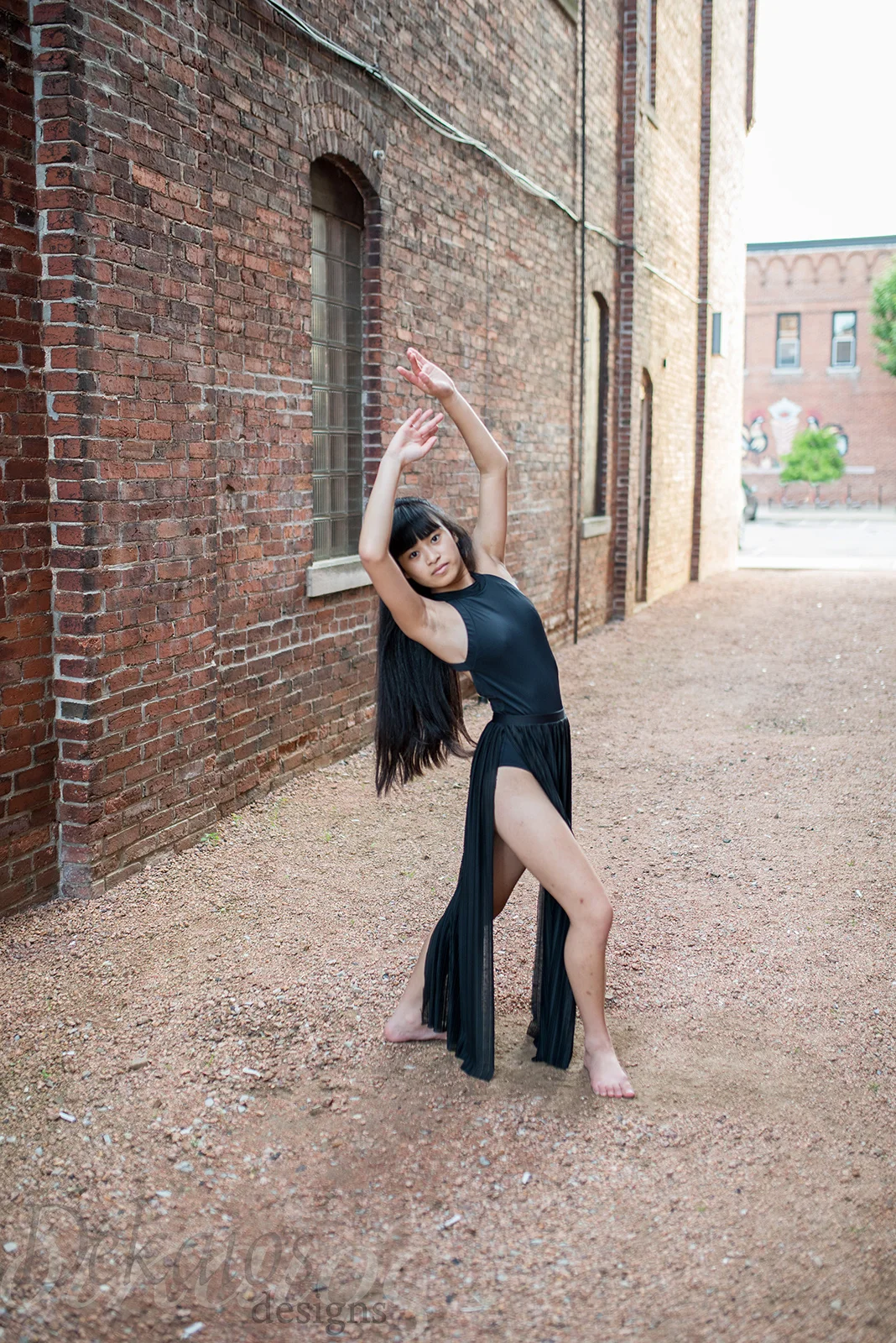 In the alley. Dancing.