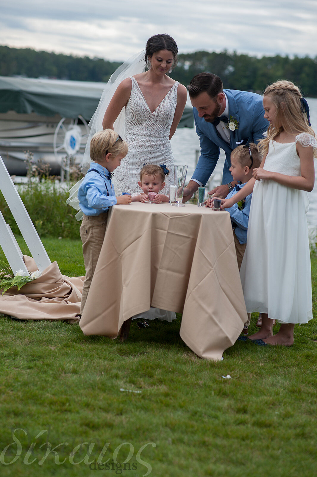 They did a “Sand Ceremony” But the sand was glass, they send it in after and have it melted into one memorial of this day and their unity as a family.