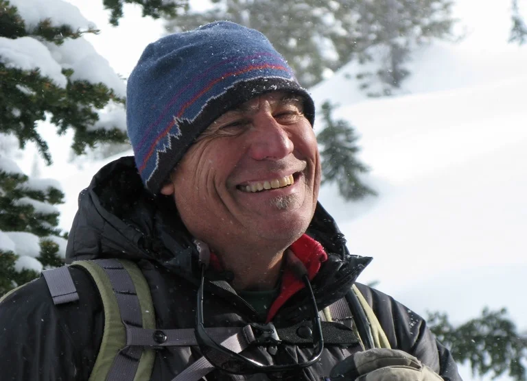  Crisp mountain air and skiing dry powder always put a smile on Kirk.      About →  