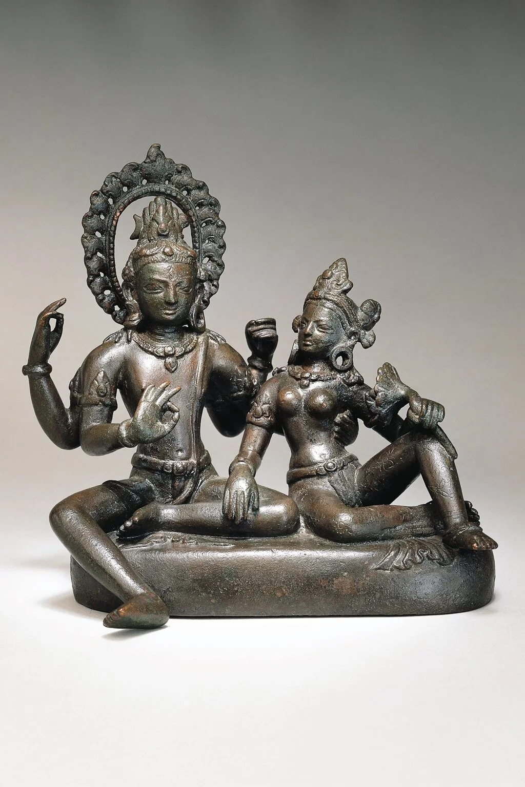 Shiva and Parvati (Uma-Maheshvara-murti) . Transitional period, late 10th–early 11th century. Nepal, Kathmandu Valley. Copper alloy. H. 6⅛ x W. 6¼ x D. 4¾ in (15.5 x 15.9 x 12 cm). Asia Society, New York: Mr. and Mrs. John D. Rockefeller 3rd Collection, 1979.48. Image courtesy Asia Society.