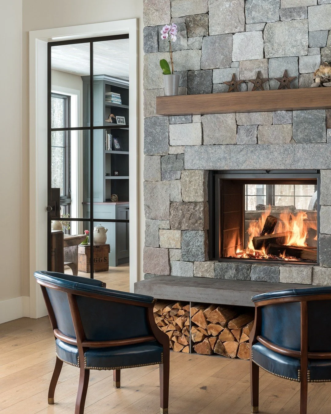 We teamed up with our sister company, @reap_construction, and @joanheatonarchitects on some custom metal features in the Bear Creek project. Steel and glass doors flank the fireplace with a metal hearth that allows for wood and kindling storage under
