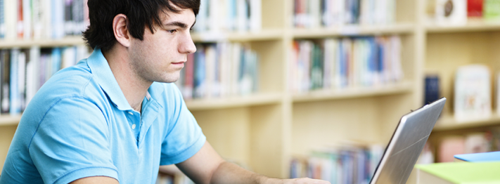student at a laptop.png