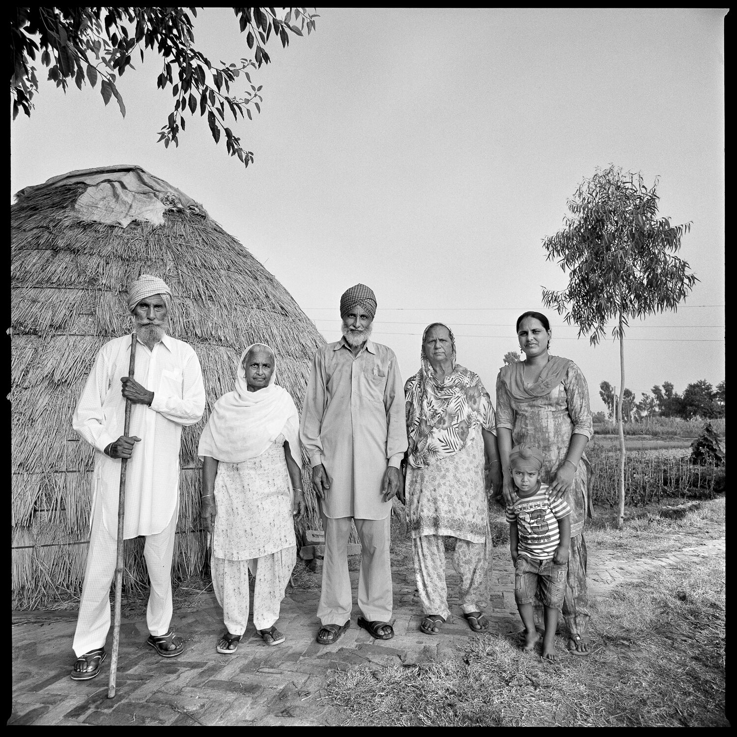   Serena Chopra,  Wariyam Singh’s Family, (L to R) Wariyam Singh, Joginder Kaur, Jaswant Singh, Palwinder Kaur, Bljit Kaur, Harnam Singh, Migrated from Village Lyallpur to Deol Village,  2017 