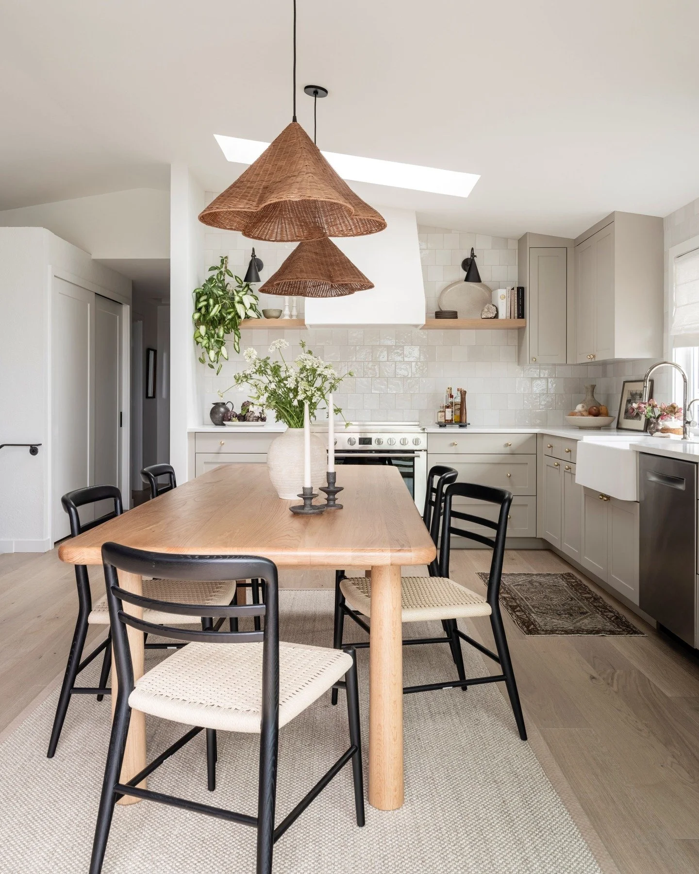 A once cramped, closed-off kitchen is now the heart of the home. Swipe to see the before! 

This home&rsquo;s original space plan featured a cramped, square kitchen with a small pass-through to the dining area and lake views. By removing the interior