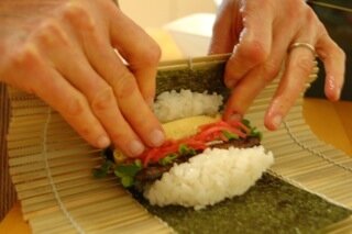 Setsuban sushi rolling, photo from tasteofculture.com