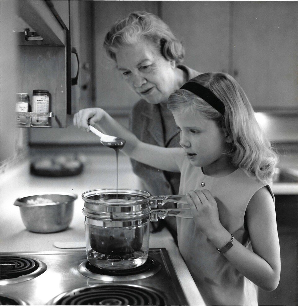 The young Janet McCracken making popcorn with her grandmother, Nell B. Nichols.