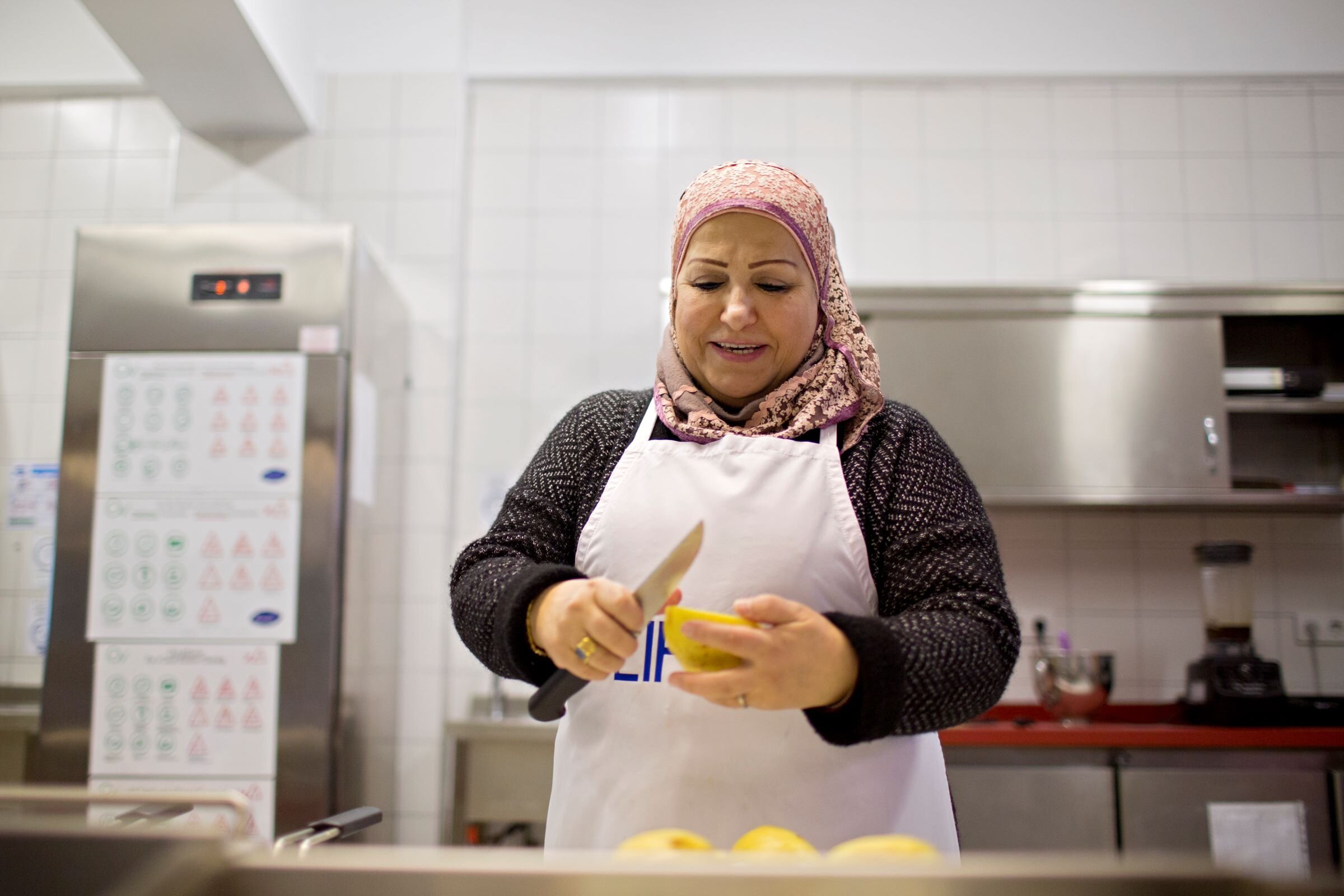 Sawsan prepares Safarjaliyeh, quince and lamb stew, featured in the Cuisine of LIFE cookbook