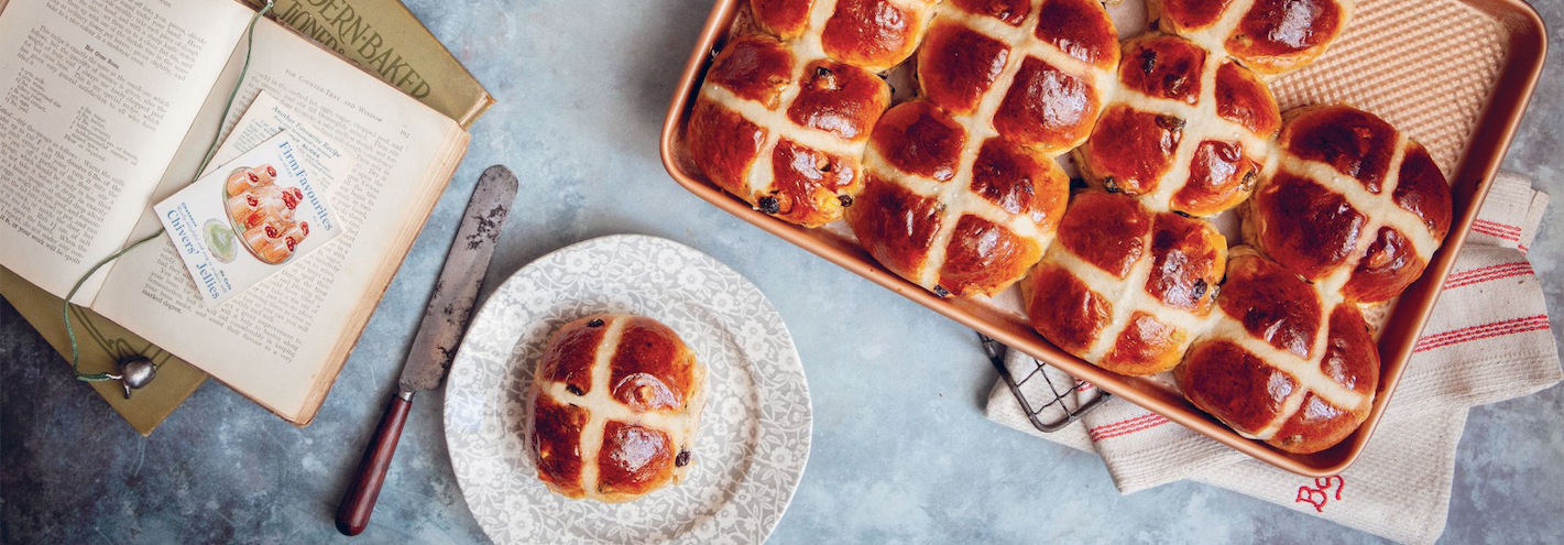 Hot cross buns, with single bun on a plate