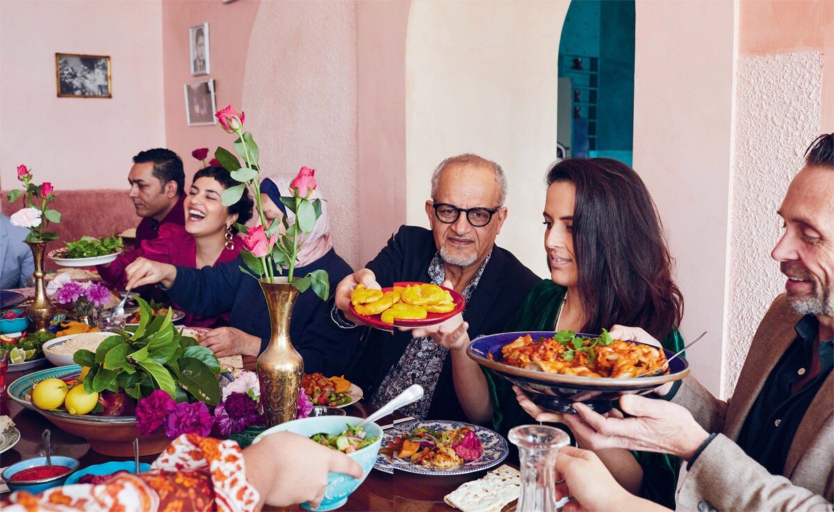 The Ayubi family enjoying a multi-generational meal.
