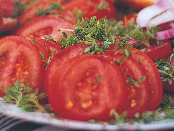 Ripe Marmande tomatoes, straight from the market to the plate.