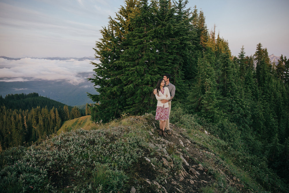 A couple in love, hugging on the top of Evergreen Mountain