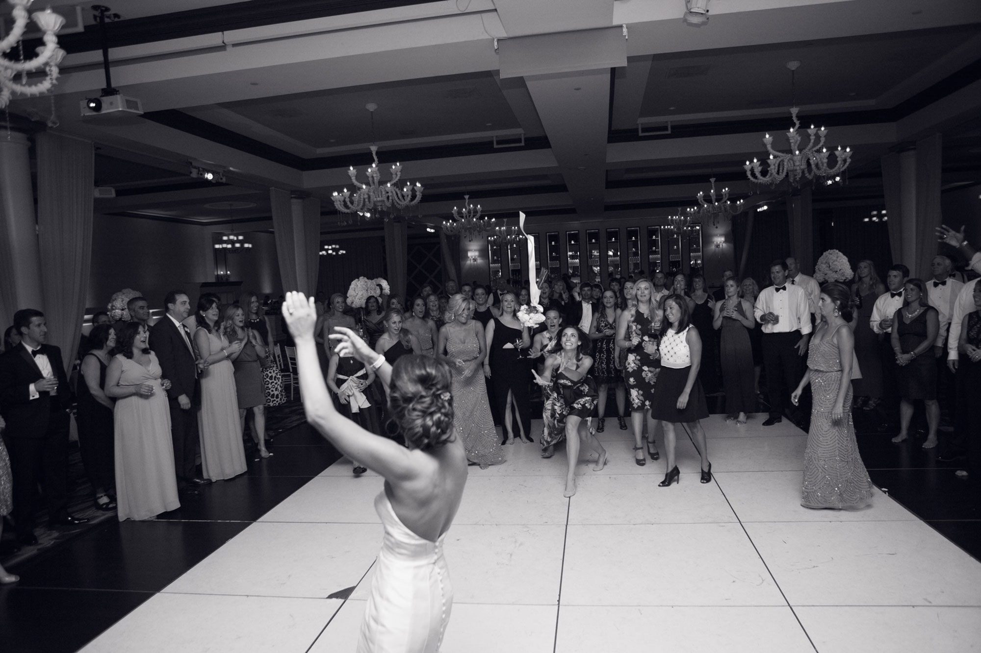 bouquet toss at a wedding reception