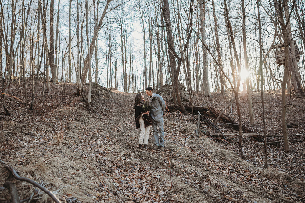 portrait of the married couple in their jumpsuits