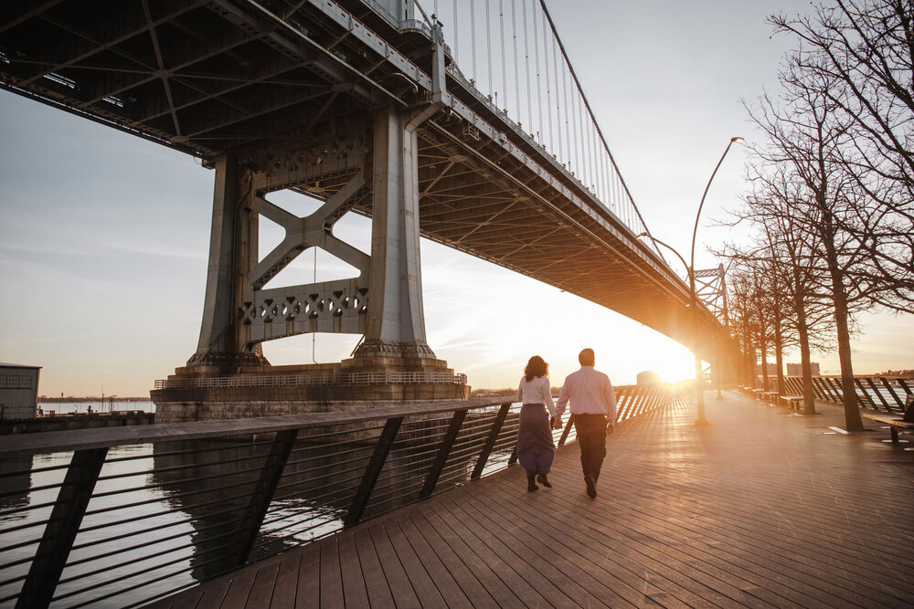 a couple walking at sunrise