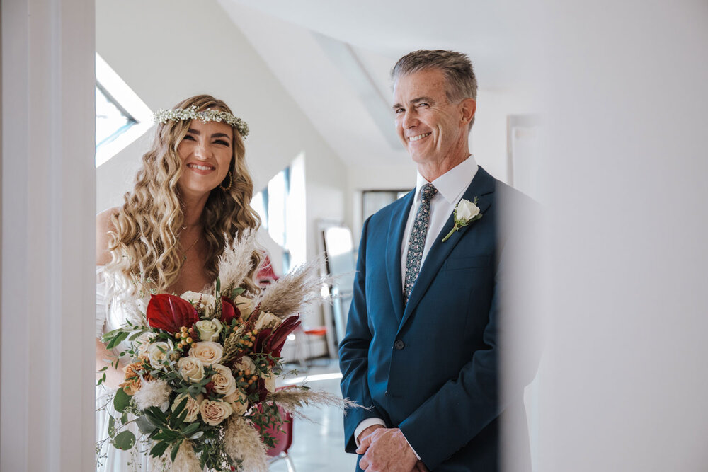 a dad getting ready to walk his daughter down the aisle