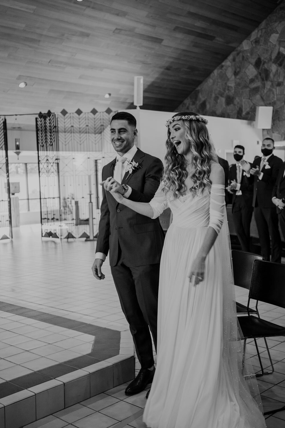 bride and groom excited about being announced husband and wife